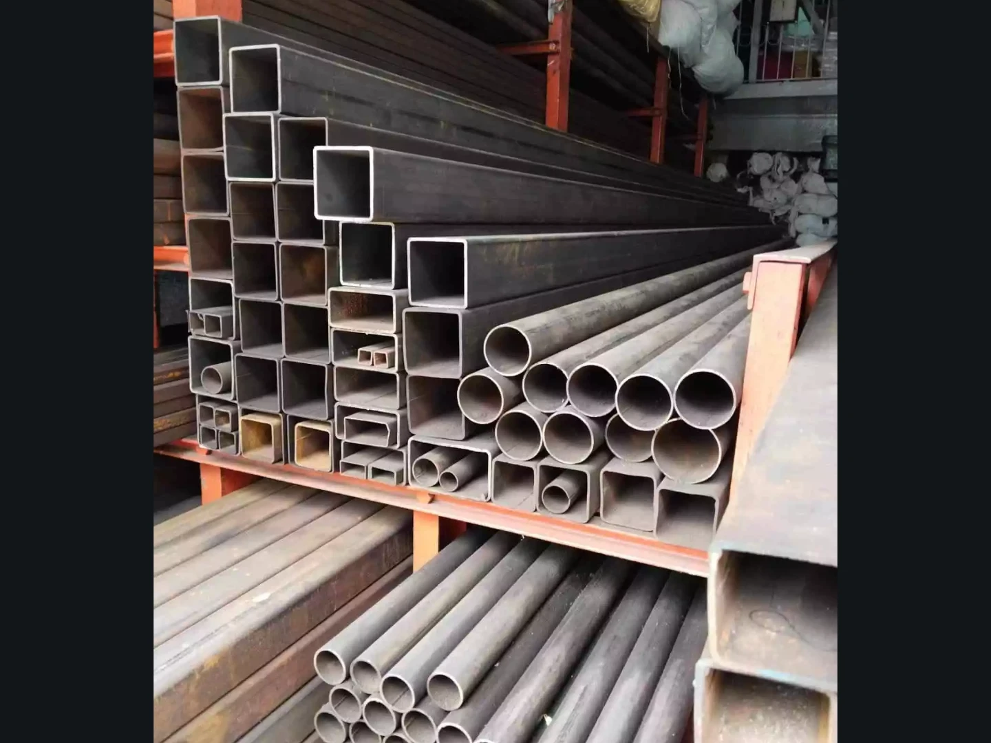 MS pipe steel framing supporting a modern car shed roof
